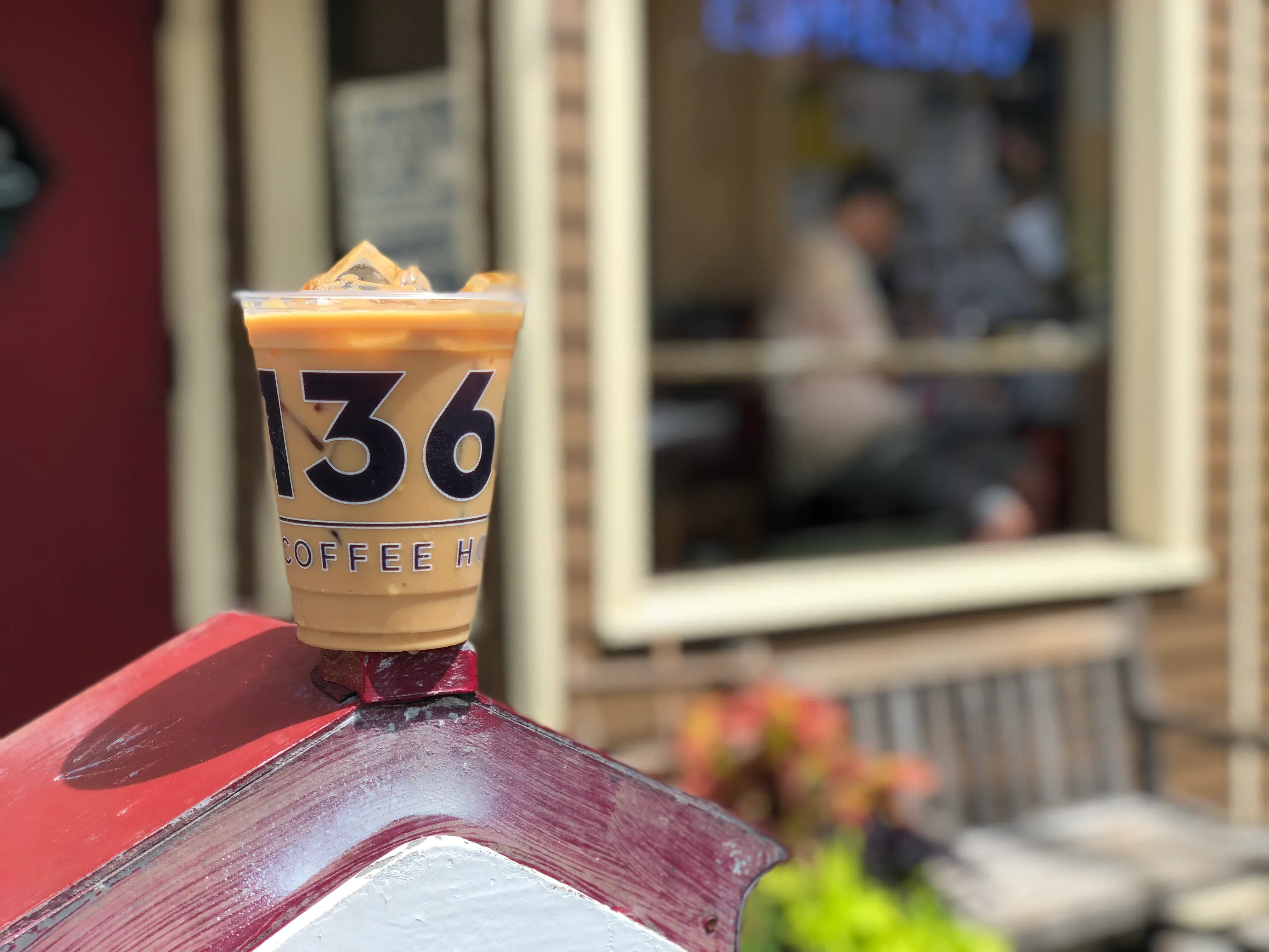 A cup of our coldbrew in front of the store.
